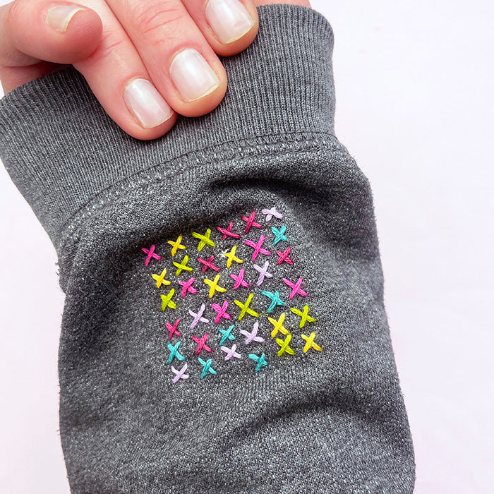 How to Embroider a Sweater Sleeve with Cross Stitch
