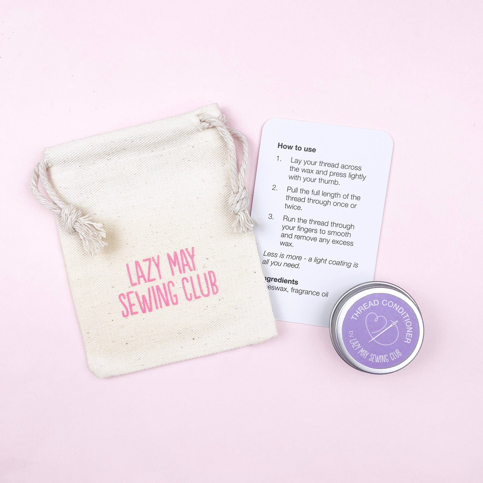 Lazy May Sewing Club thread conditioner with packaging and instructions on a light pink background