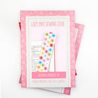 Embroidery kit packaging with colorful flowers and text on a white background