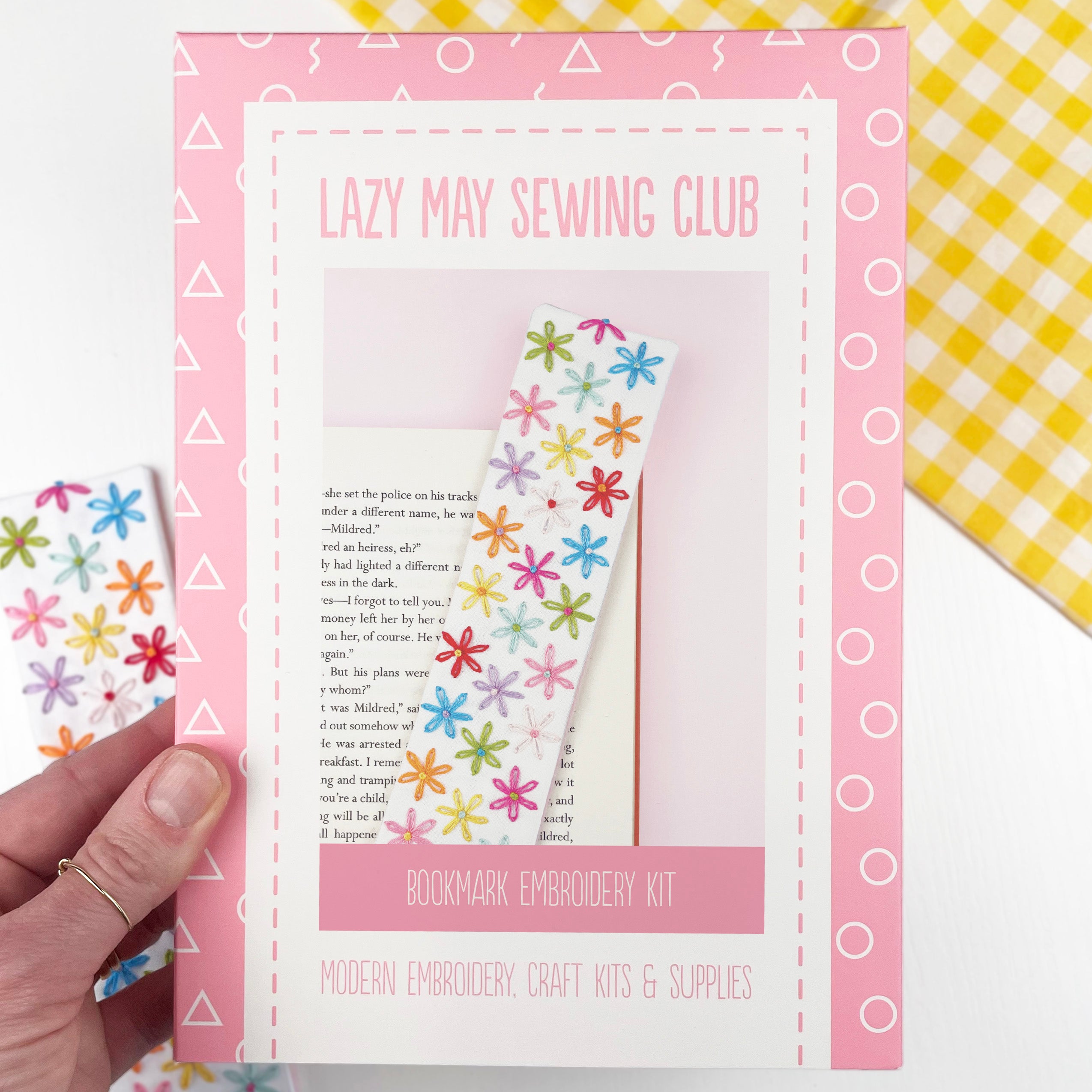 Lazy May Sewing Club bookmark embroidery kit with colorful flowers on a pink card