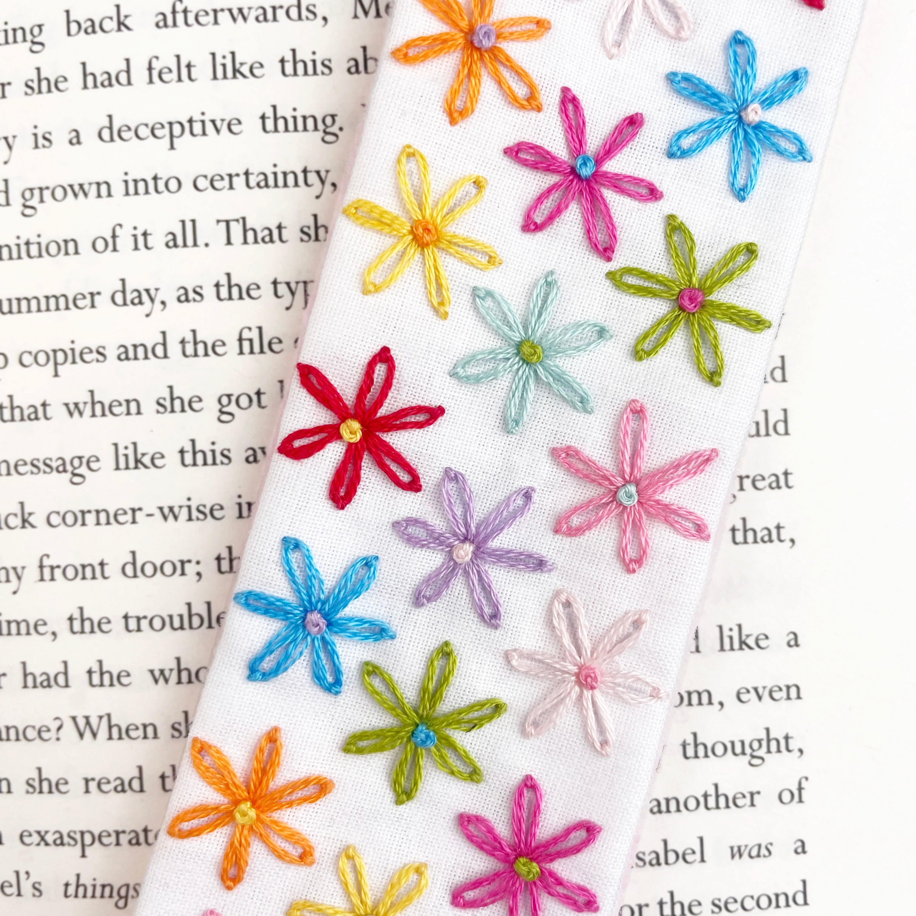 Colorful embroidered flower designs on Hand embroidered bookmark made from a craft kit