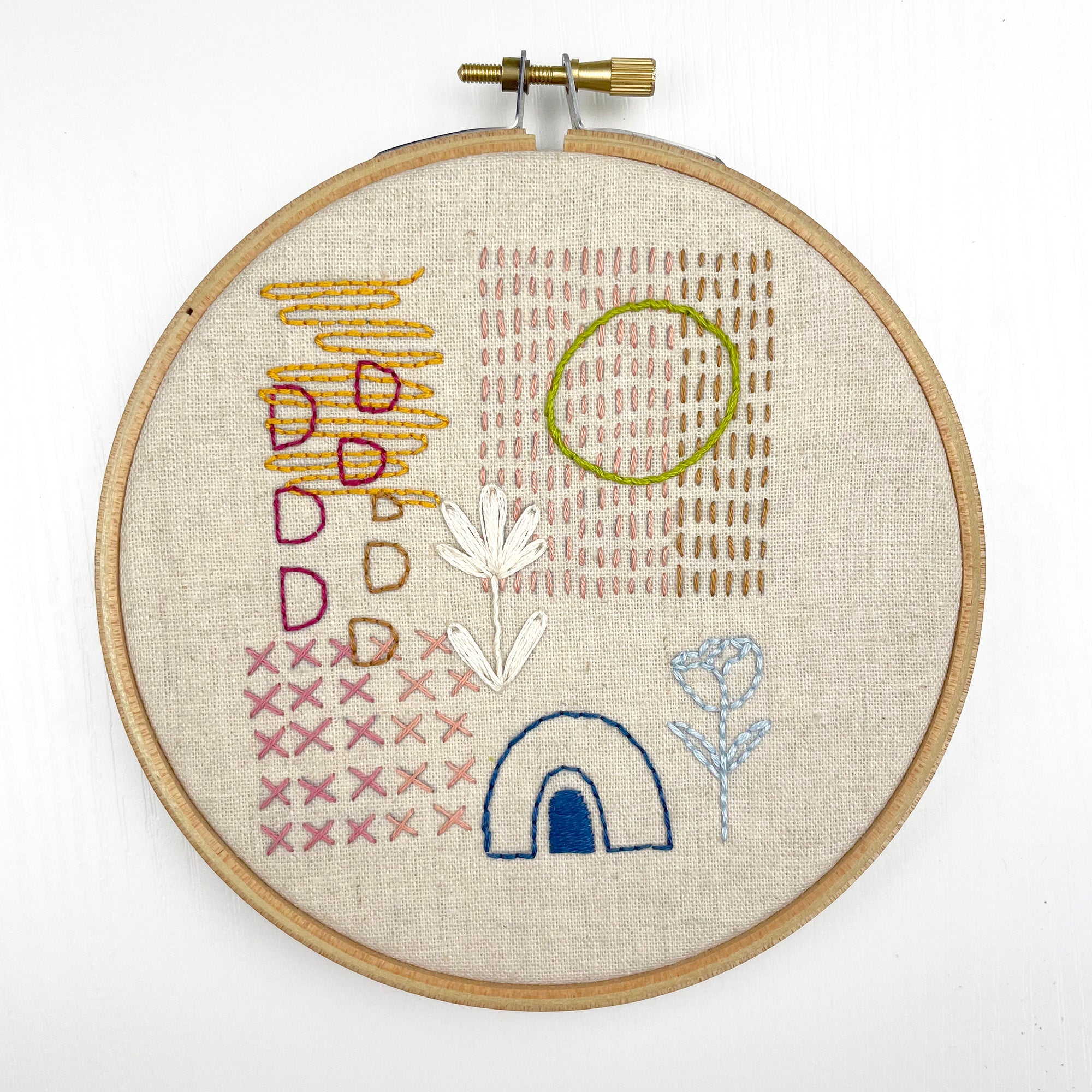 Hand embroidery hoop featuring abstract floral and geometric stitches in various colors Iron-On Embroidery Patterns: Slow Stitching Textures