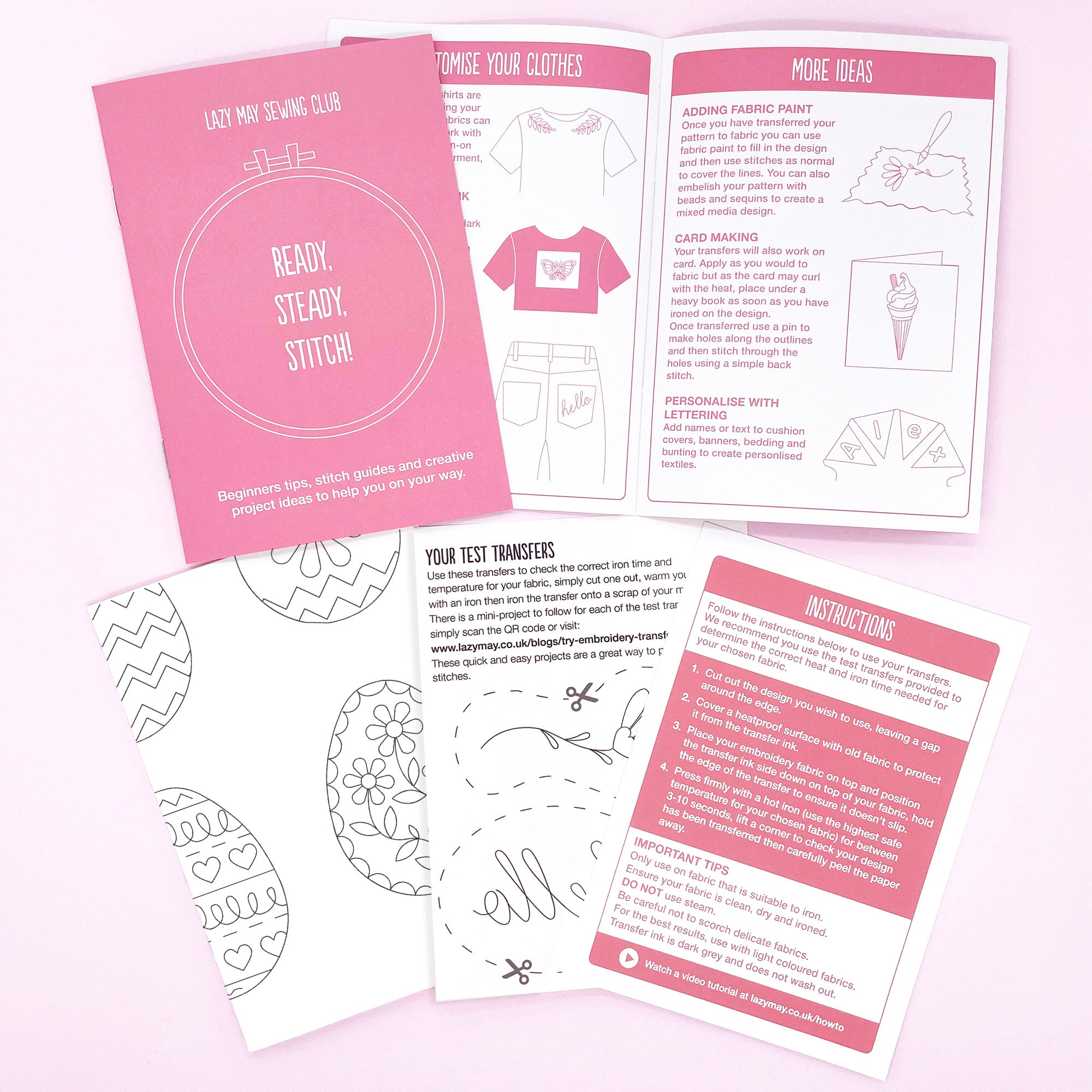 Sewing kit with pink and white materials on a light pink background