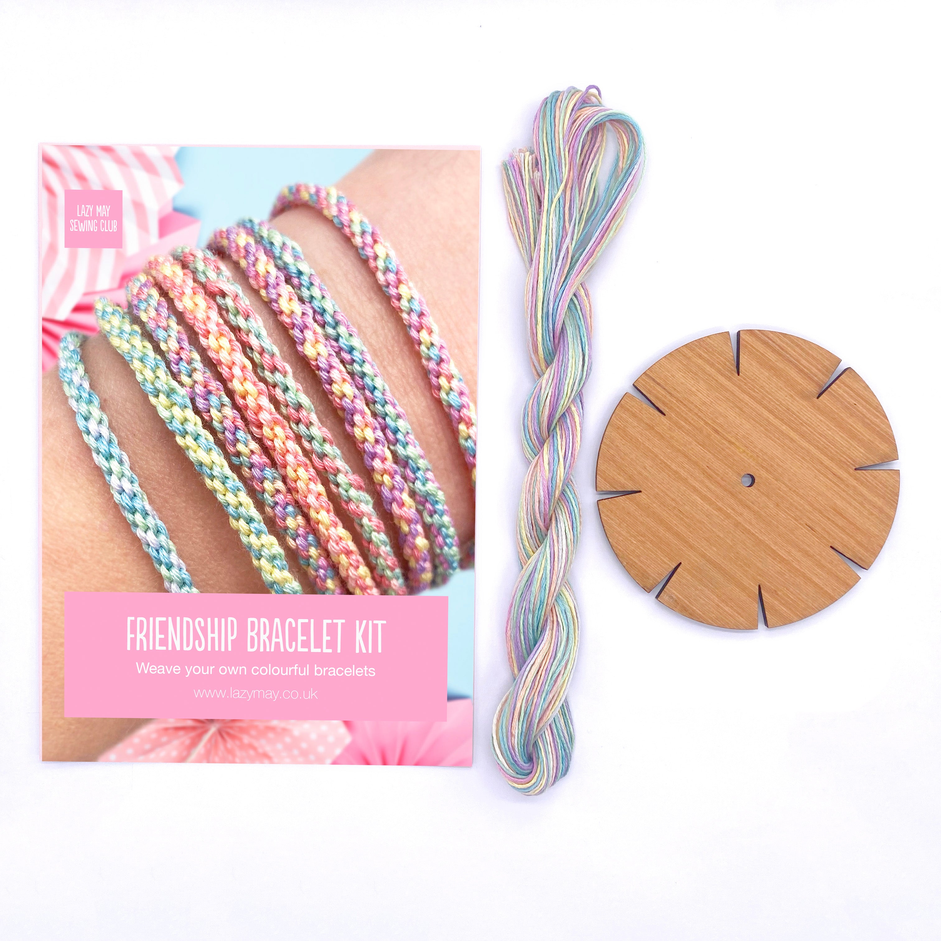 Friendship Bracelets Kit contents including wooden loom, instruction card and pre-cut pastel threads – ideal kids bracelet making set.