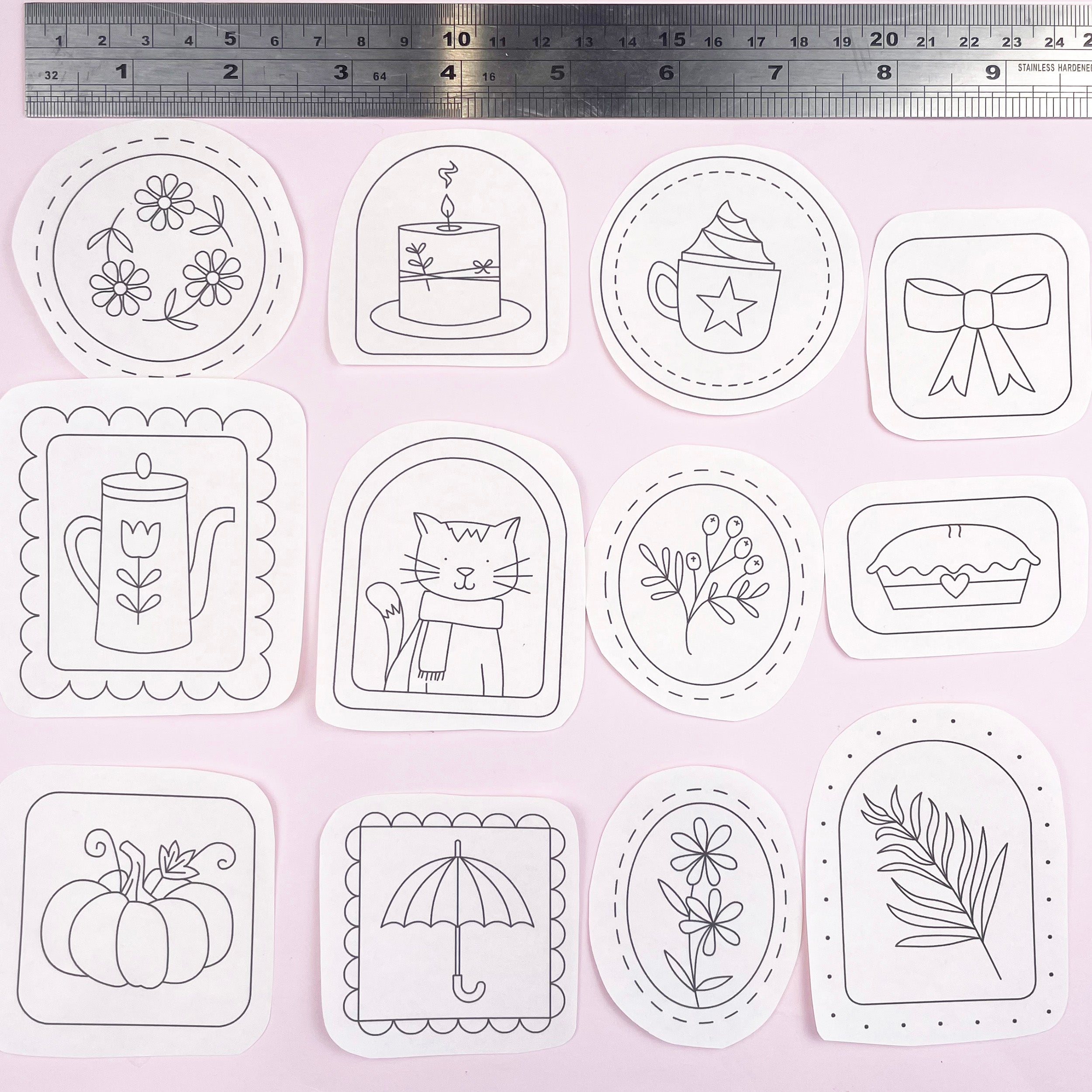 Set of cosy autumn themed embroidery patterns illustrations on a white background with a ruler at the top.
