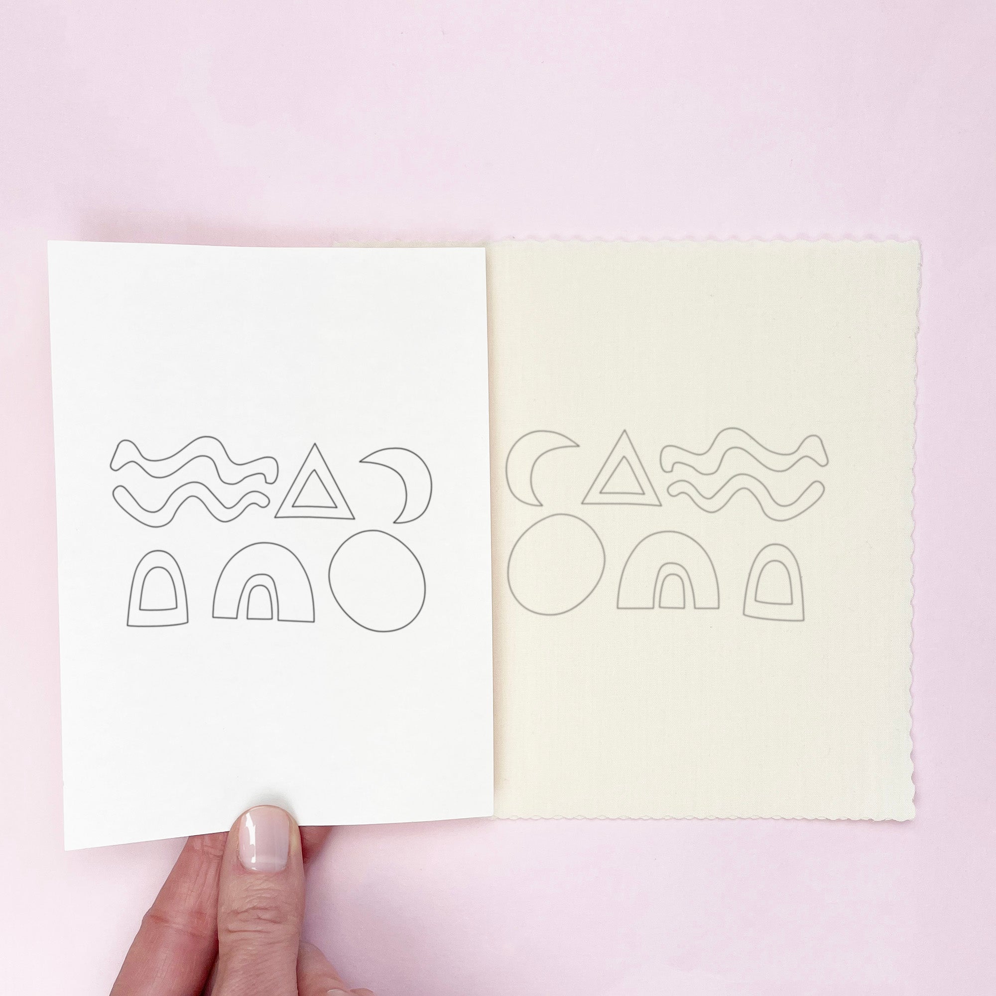 Hand holding sheet with geometric outlines next to fabric sheet showing same iron-on embroidery patterns for Slow Stitching Textures