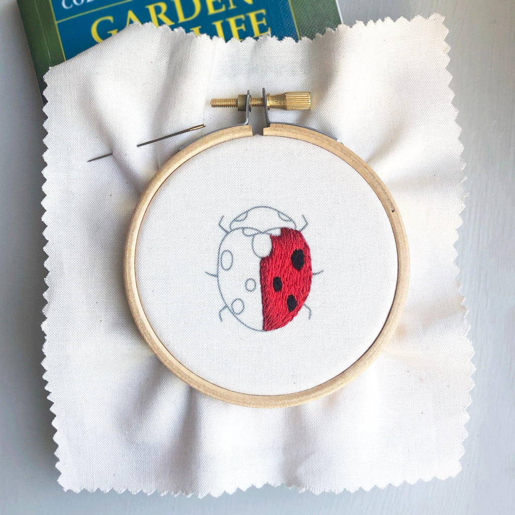 Bugs and Butterflies: Iron-On Embroidery Transfer Patterns - Lazy May Embroidery hand embroidered ladybird in a embroidery hoop