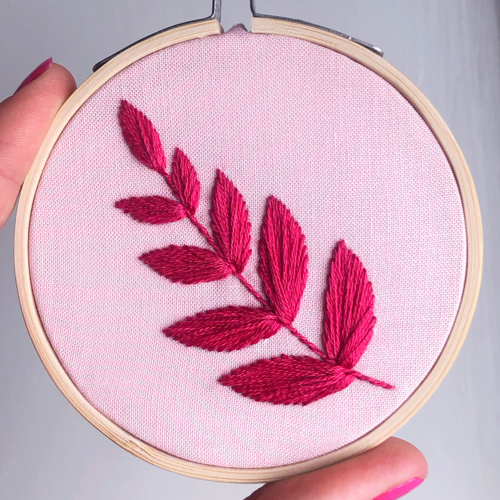Pink embroidery hoop stitched with bright pink leaf design mini 3 inch hoop close-up image