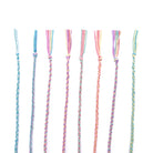 eight handmade kumihimo bracelets in pastel colours, partially woven using the Lazy May friendship bracelet kit.
