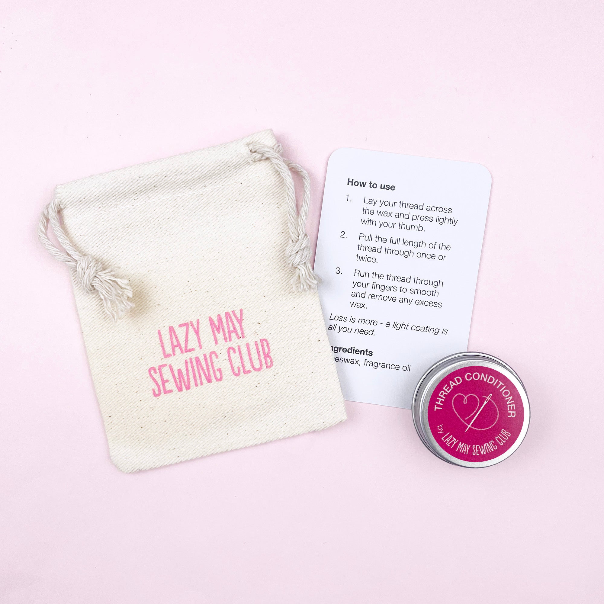 Lazy May Sewing Club thread conditioner with packaging and instructions on a pink background
