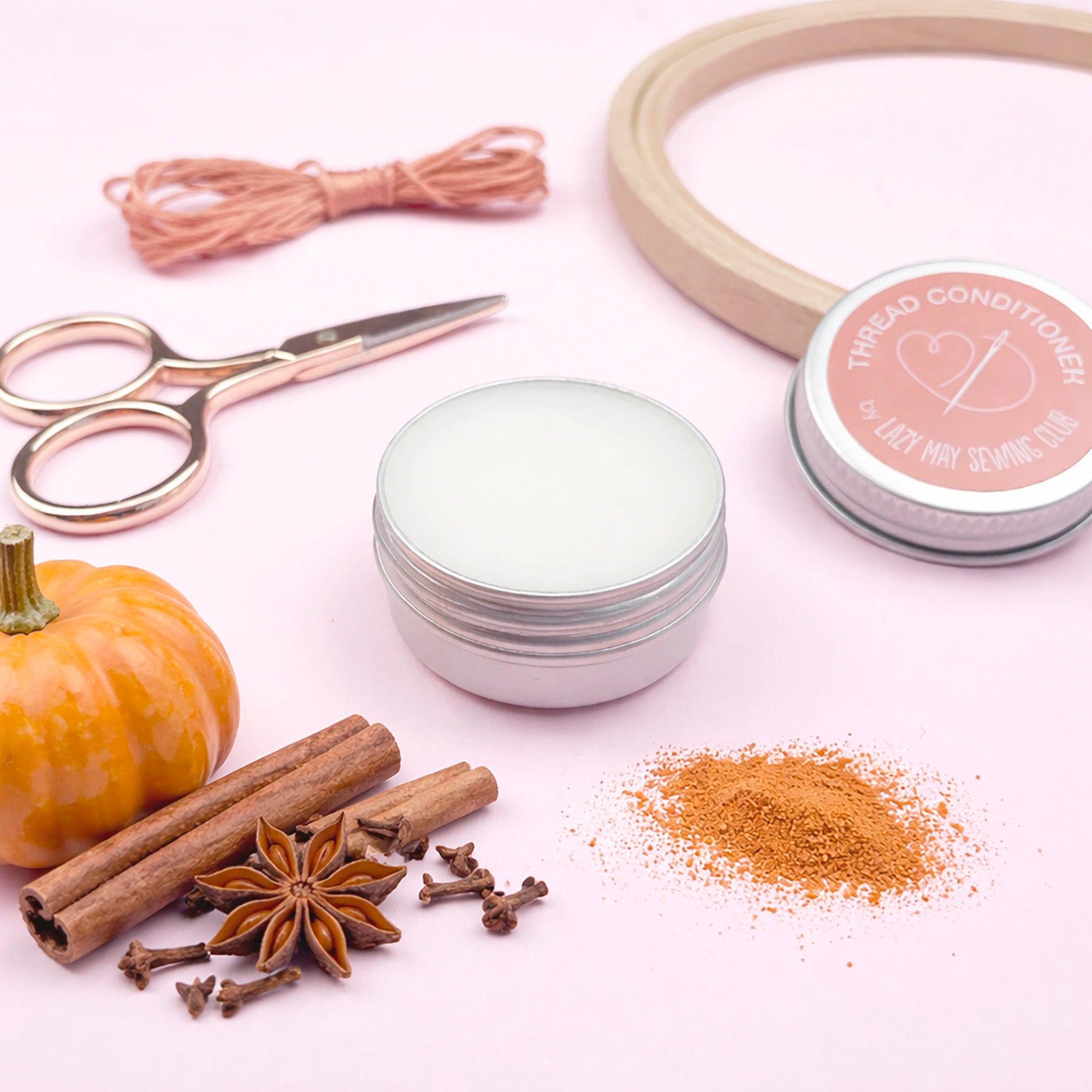Spices, a pumpkin, scissors, and containers on a white background
