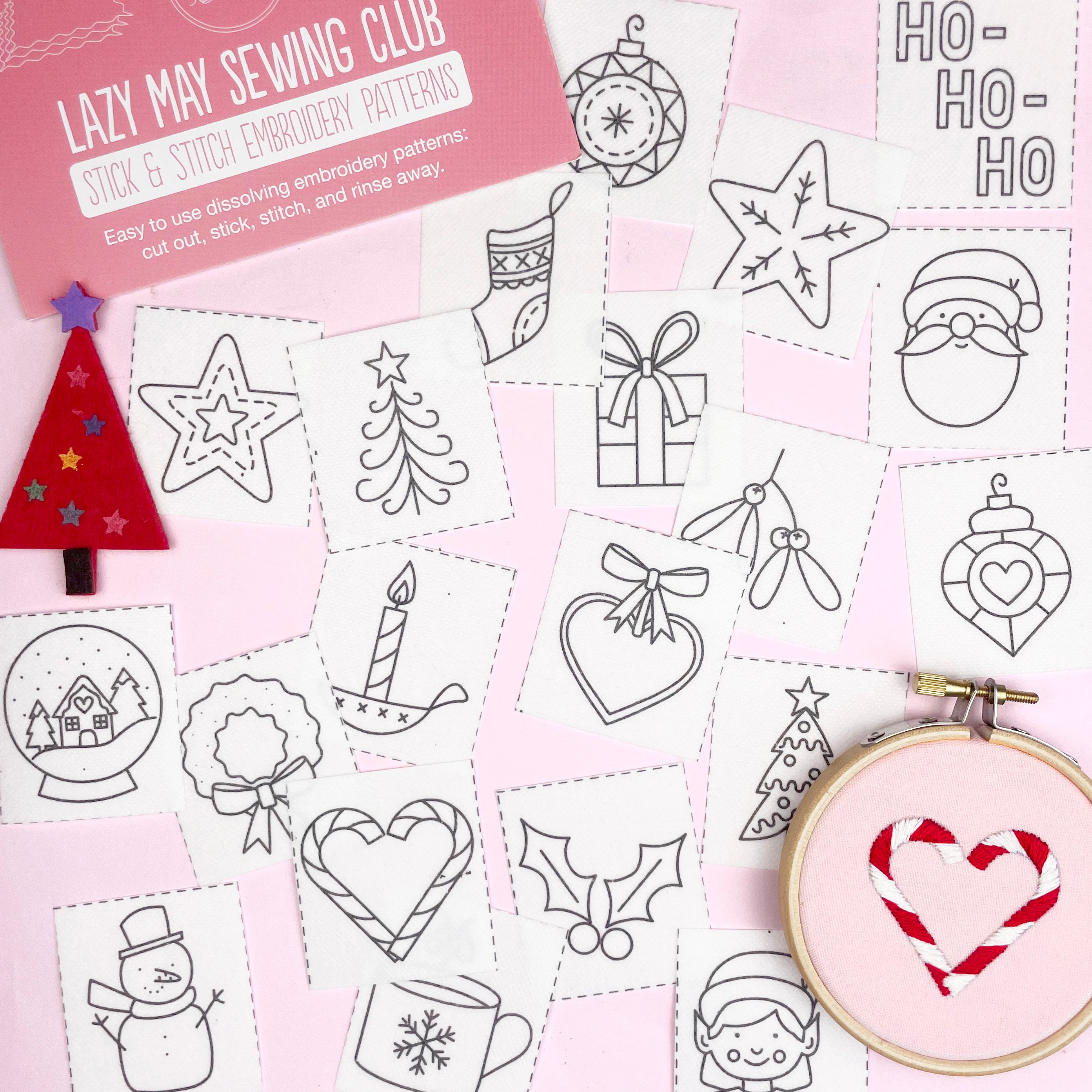 Embroidery patterns with Christmas-themed designs on a pink background, featuring an embroidery hoop with a completed design.