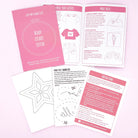A flat lay of sewing club instruction sheets and templates on a pale pink background. The set includes a pink cover card reading 'Lazy May Sewing Club' and 'Ready, Steady, Stitch!', an open booklet with sewing ideas, and several white pattern transfer sheets with pink headers.