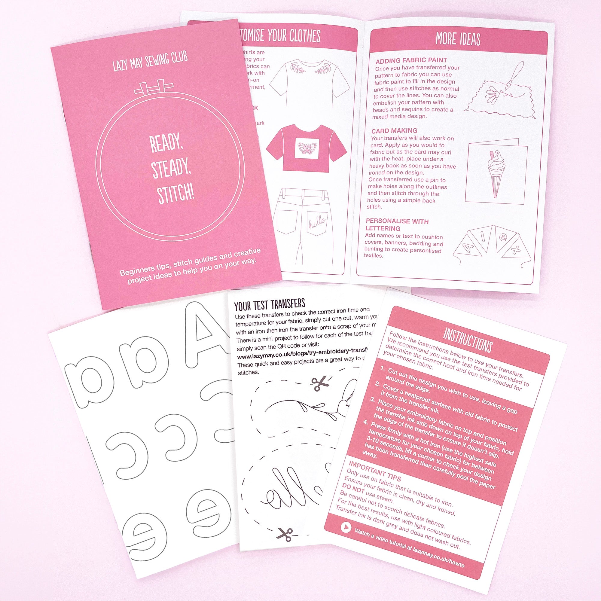 Sewing kit with pink and white materials on a light pink background