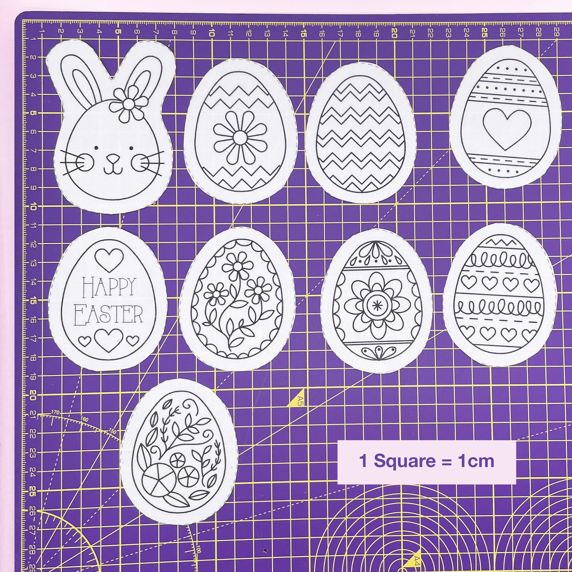 Easter embroidery design sheet with dissolving stick and stitch patterns, featuring an Easter bunny and decorated Easter eggs. Modern Easter embroidery patterns for stitching onto fabric.