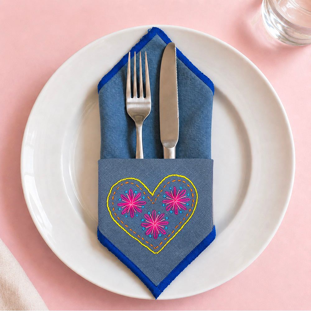Embroidery on jeans pocket with heart design