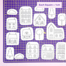 Black and white house, tree, and cloud embroidery transfer designs on cutting mat for Little Houses: Stick and Stitch Embroidery Patterns