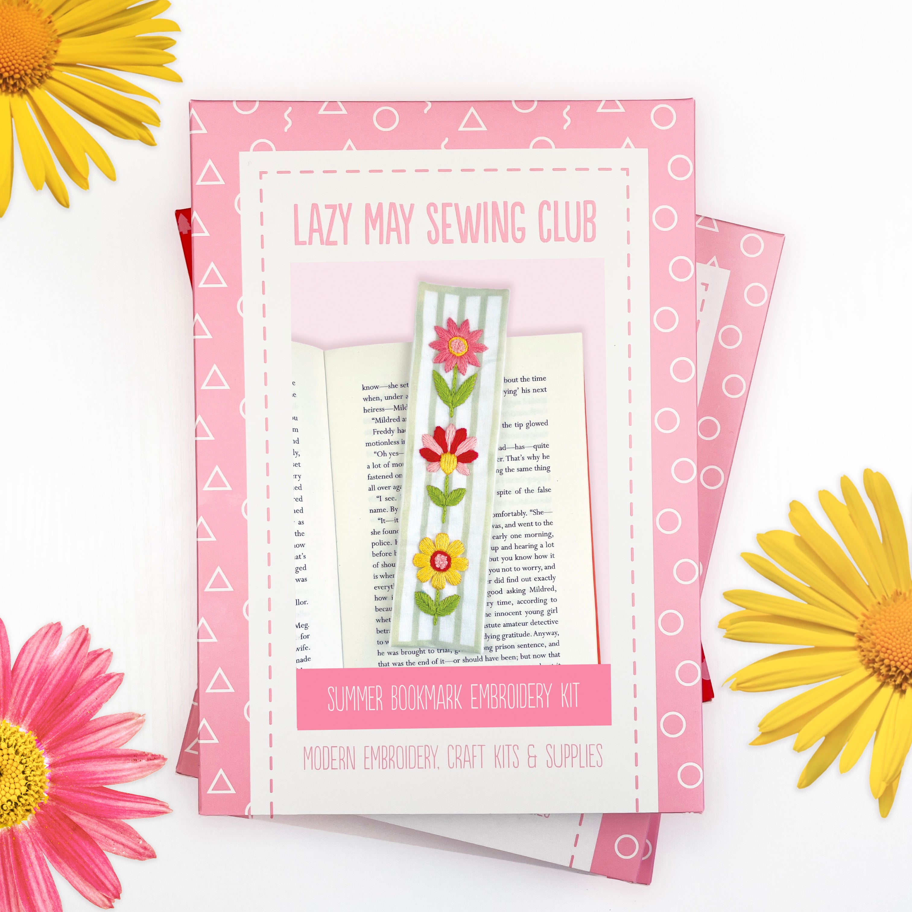 Embroidery kit packaging for 'Lazy May Sewing Club' with flowers on a white background. Box for a sew your own bookmark kit