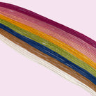 Colorful natural thread palette arranged on a light background for beginner embroidery projects.