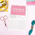 Iron-On Embroidery Patterns: Slow Stitching Textures with sewing tools including scissors, thread, and embroidery hoop on pink background