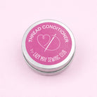 Thread conditioner container with pink label on a light pink background