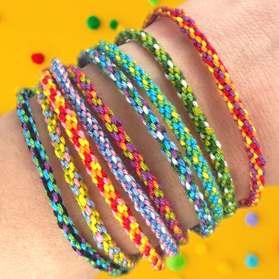 rainbow woven friendship bracelet kit with colourful bracelets on a wrist