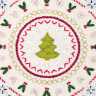 Embroidered design of a Christmas tree surrounded by festive patterns on a white background.