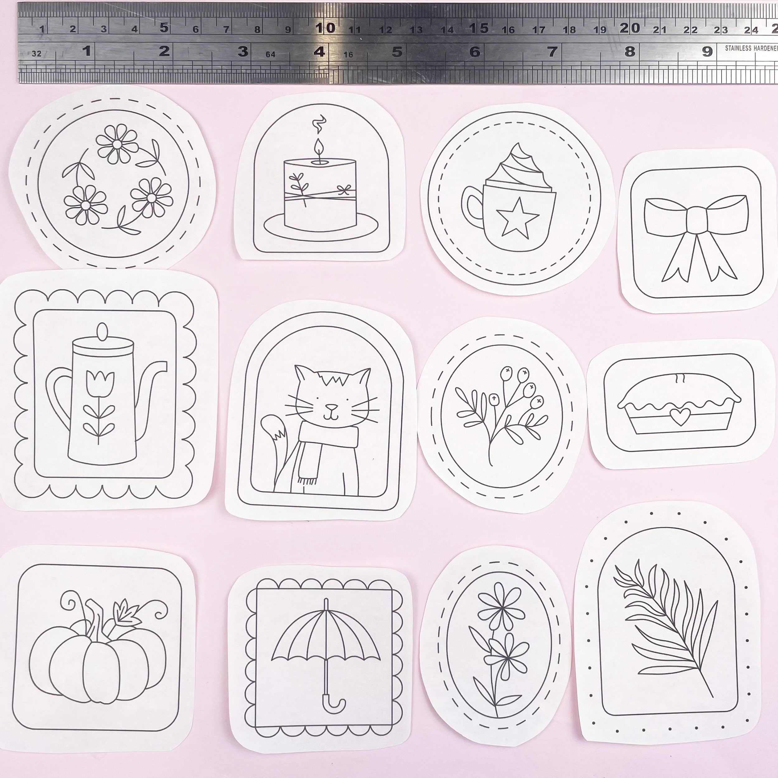 Set of cosy autumn themed embroidery patterns illustrations on a white background with a ruler at the top.