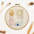 Embroidered hoop with colorful abstract stitches showing organic shapes and textures Iron-On Embroidery Patterns Slow Stitching Textures