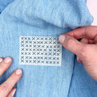 Applying Slow Stitching Textures: Stick and Stitch Embroidery Patterns iron-on transfer to blue fabric for easy embroidery.