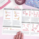 Open embroidery guide showing beginner-friendly stitch instructions with colorful thread diagrams and text explanations.