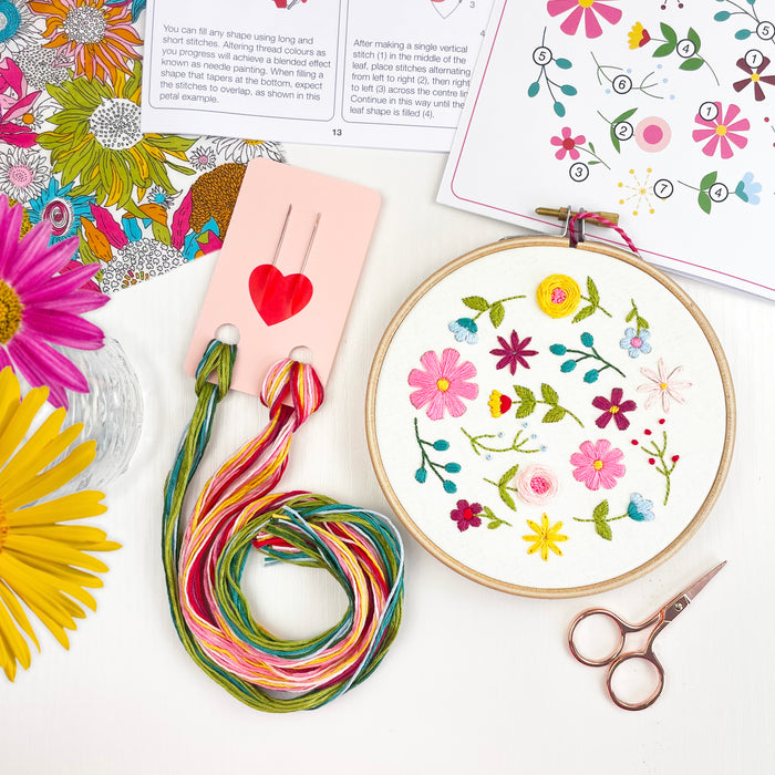 Fabulous Flowers Embroidery Kit with a colourful stitched floral hoop, threads and step-by-step instructions.