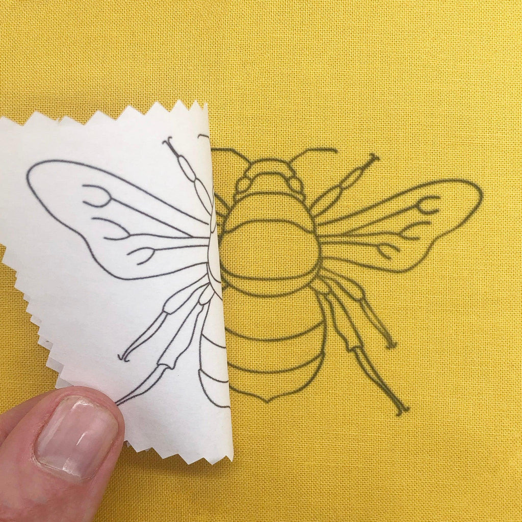 Bugs and Butterflies: Iron-On Embroidery Transfer Patterns - Lazy May Embroidery embroidery transfer of a bee ironed onto yellow fabric